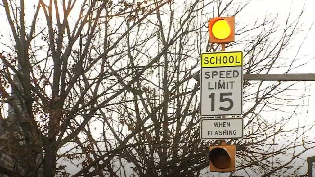 A traffic signal warns Charleston drivers that students are in the area, crossing streets to get to Charleston Catholic High School. (Eyewitness News){&nbsp;}{p}{/p}