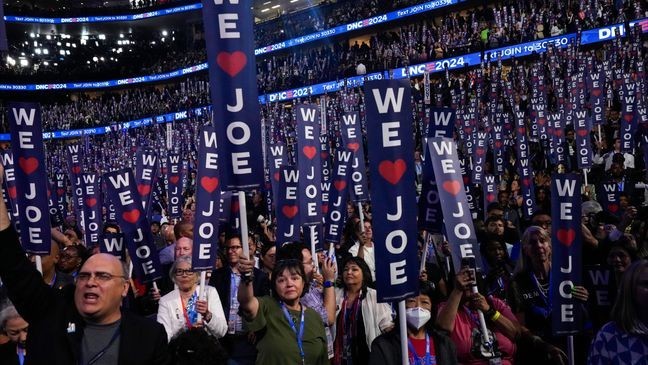 Delegates cheer as President Joe Biden speaks during the first day of Democratic National Convention, Monday, Aug. 19, 2024, in Chicago. (AP Photo/Jacquelyn Martin)