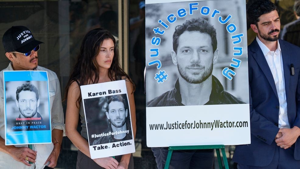 Gina Eva, second from left, and Micah Parker, "Vampire Diaries," actor, producer, and organizer of Justice for Johnny Wactor, right, attend a news conference outside the Clara Shortridge Foltz Criminal Justice Center in Los Angeles, Monday, Aug. 19, 2024. Los Angeles County District Attorney George Gascon plans to announces charges Monday in the killing of former “General Hospital” actor Wactor. (AP Photo/Damian Dovarganes)